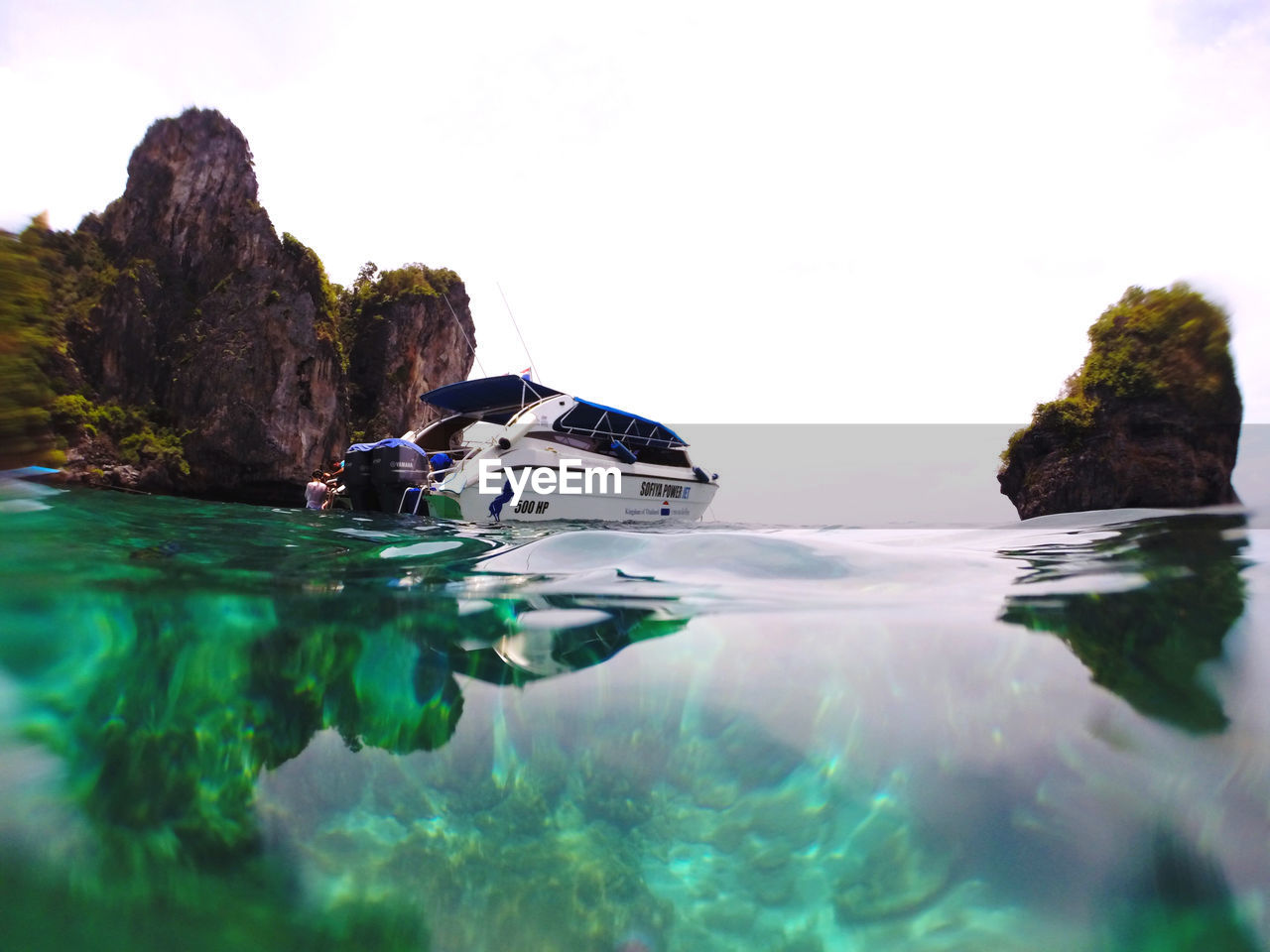 ROCKS IN SEA AGAINST SKY