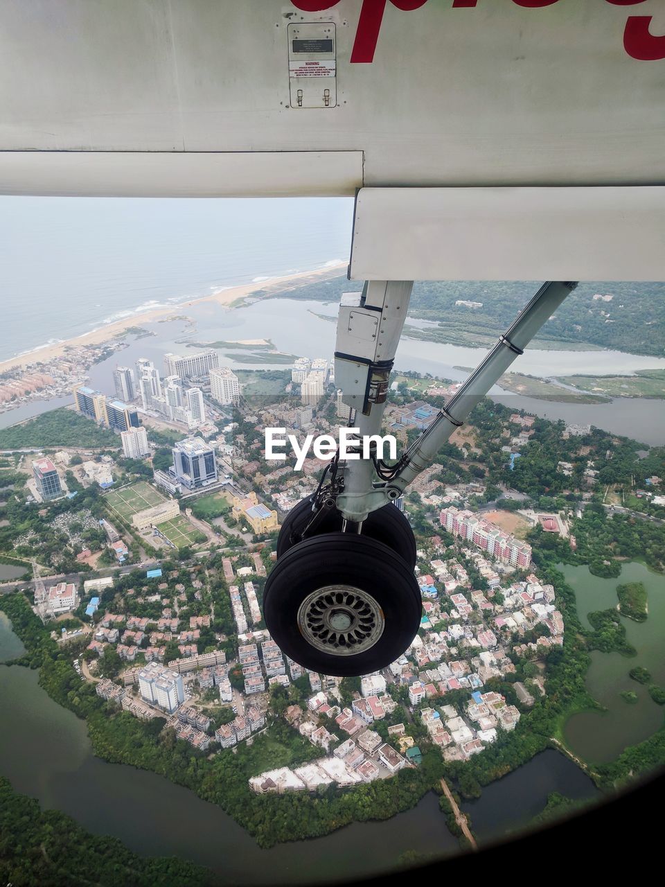 CLOSE-UP OF AIRPLANE FLYING AGAINST SKY