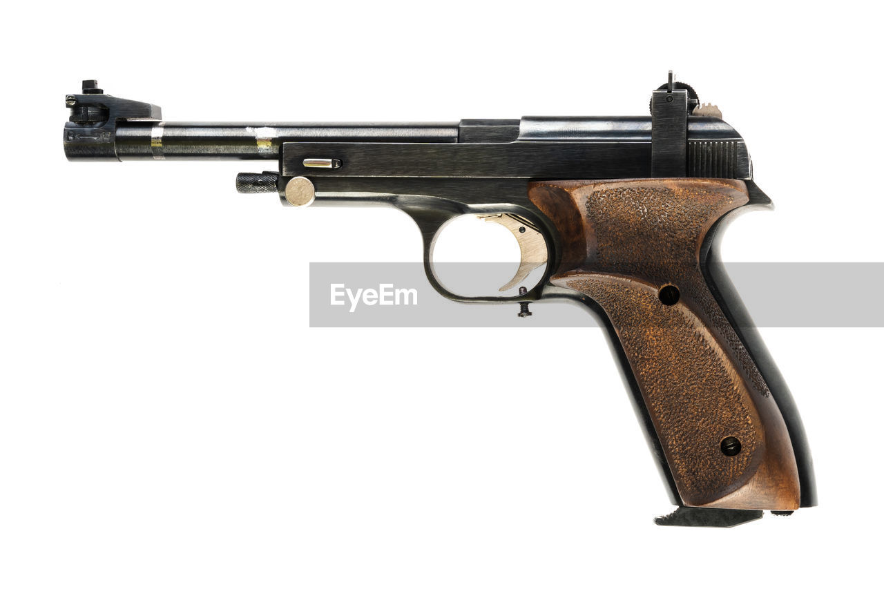 Close-up of gun on white background
