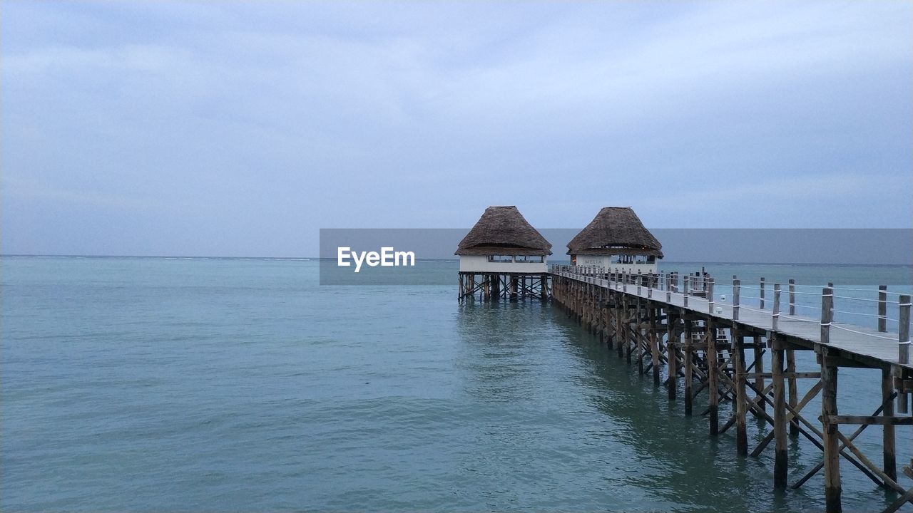 Pier over sea against sky