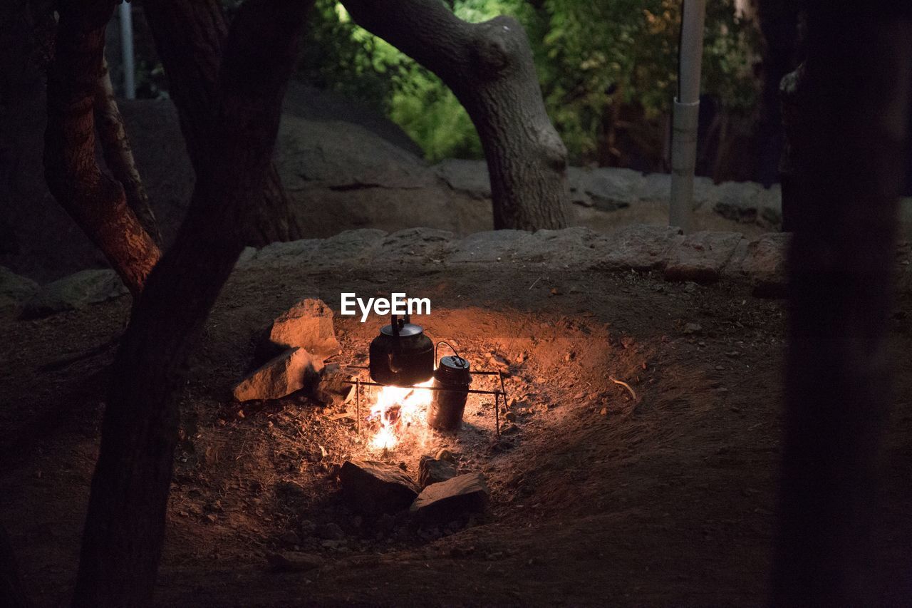 High angle view of kettle on fire at campsite