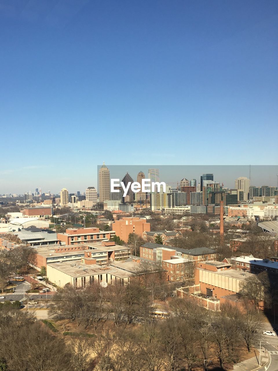 High angle view of cityscape against clear blue sky