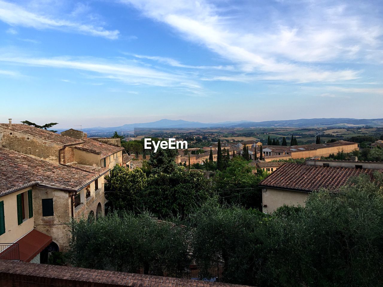 High angle view of trees and houses against sky