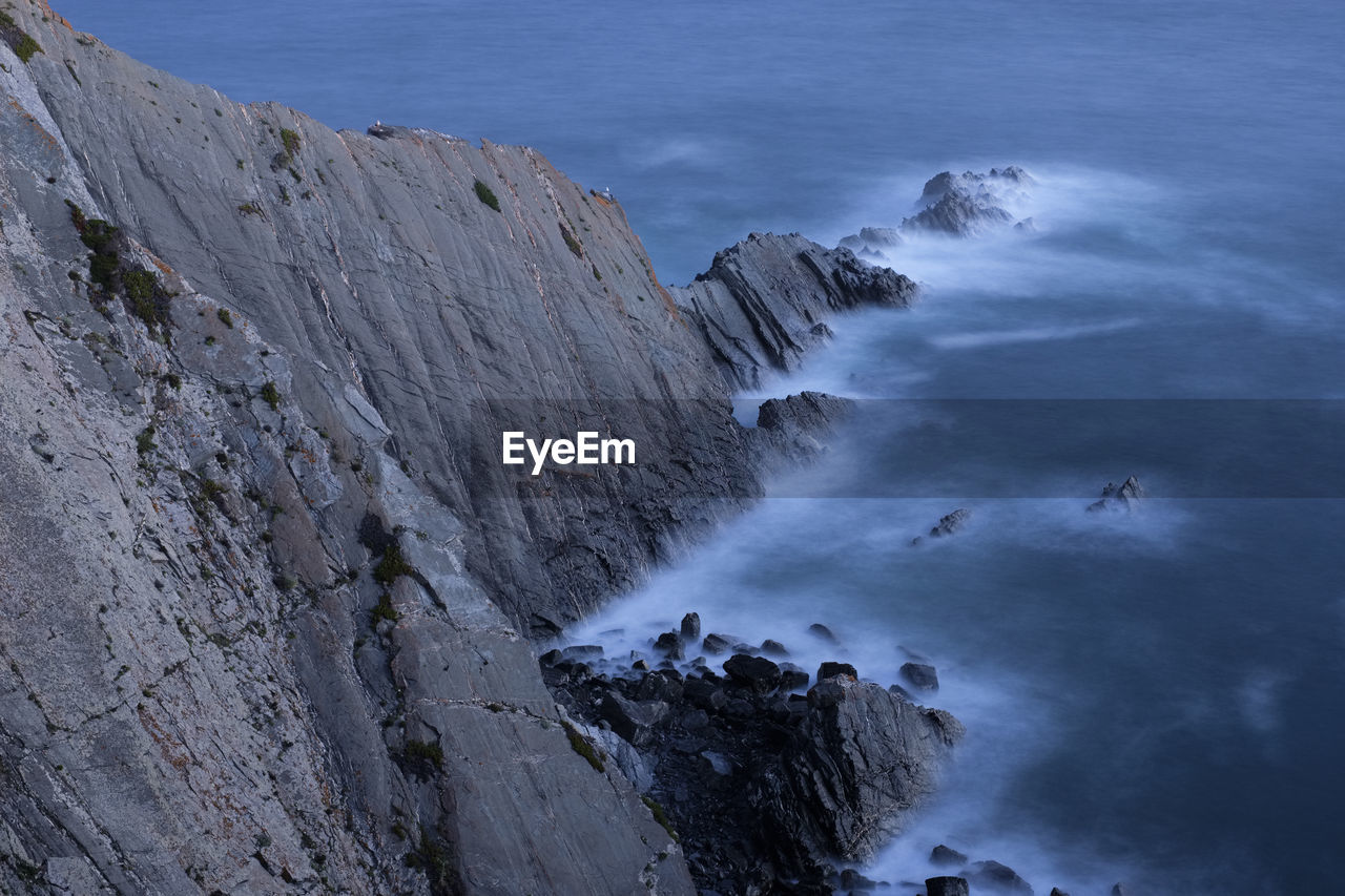 Scenic view of rock formation in sea