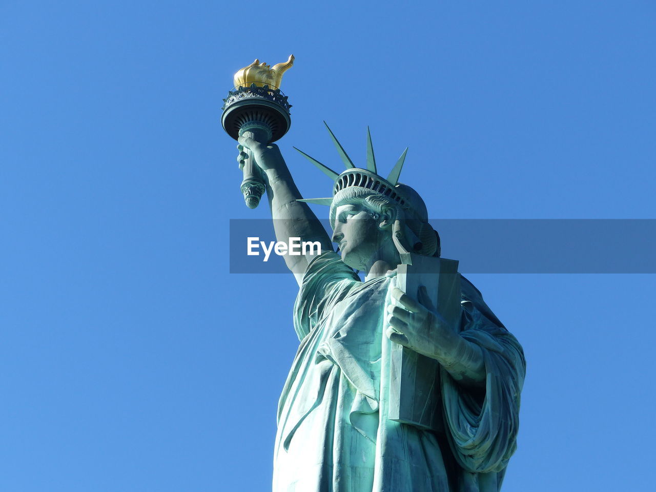 Statue of liberty against clear blue sky