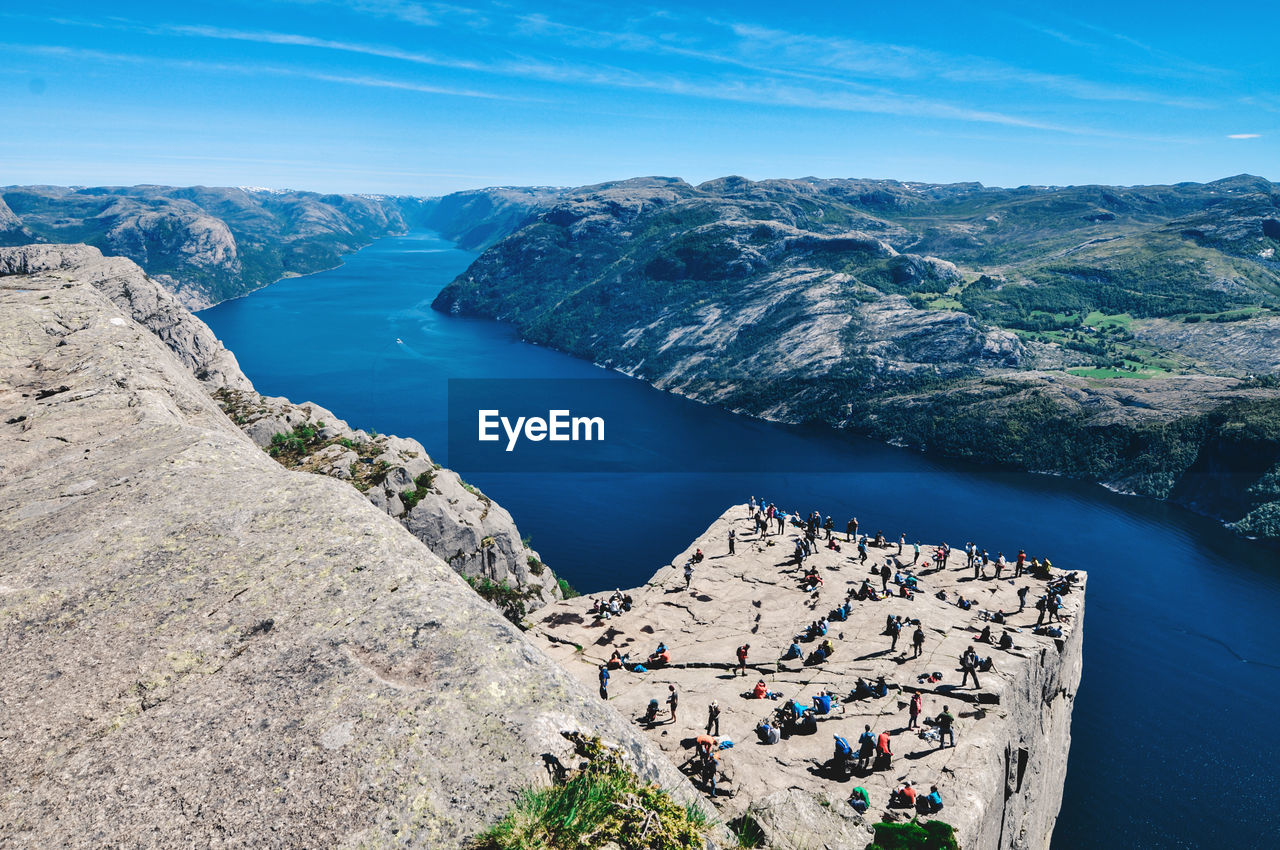 High angle view of rocks and sea against sky