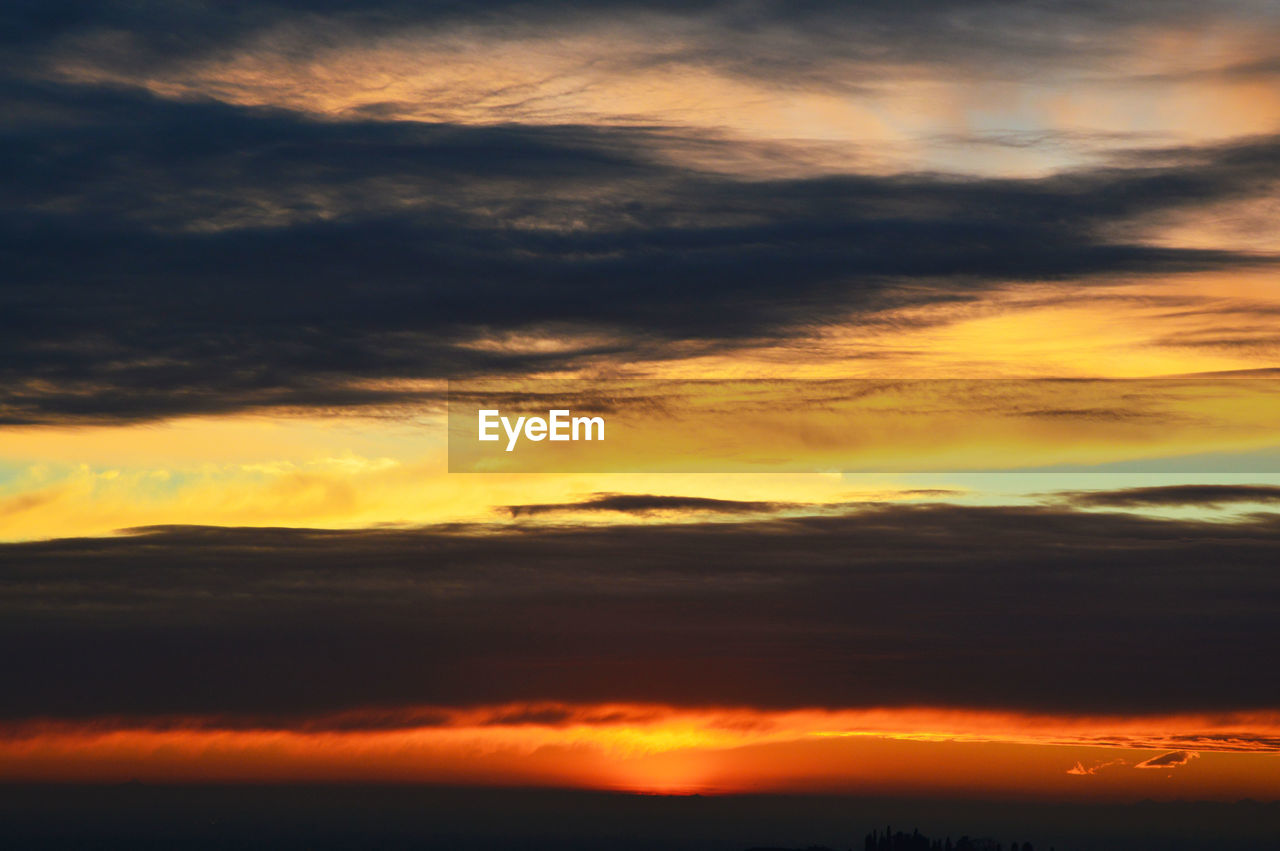 Scenic view of dramatic sky during sunset