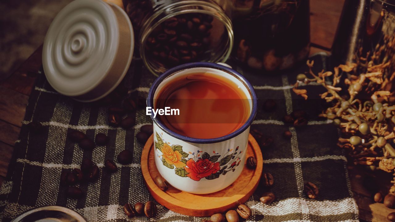 High angle view of milk coffee served on table