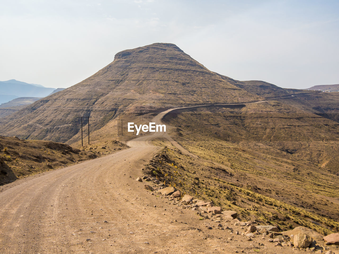 Scenic view of mountain road against sky