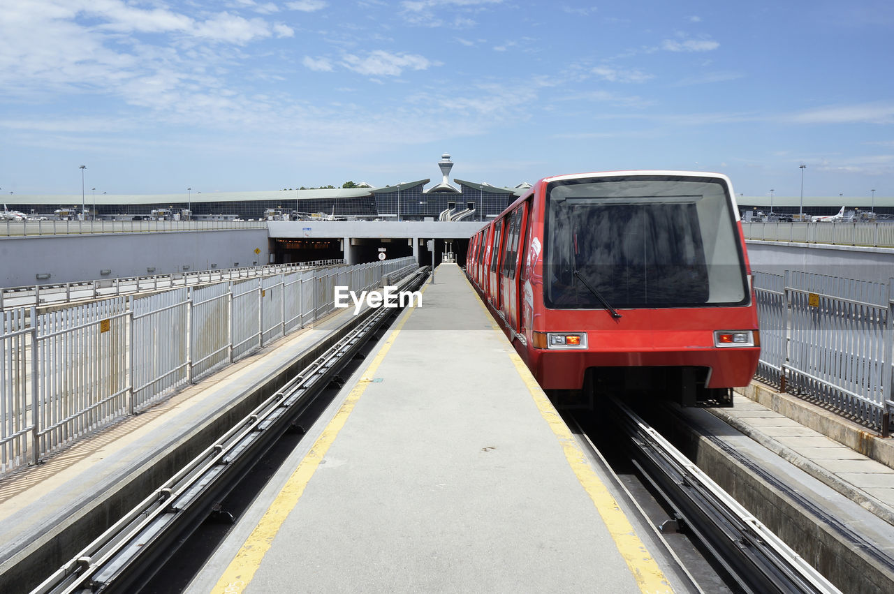 Airport train in front of airport