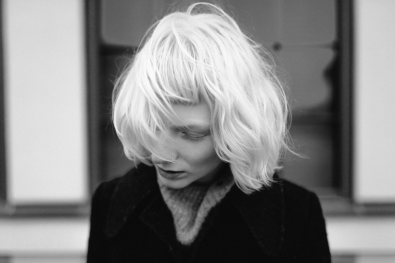 PORTRAIT OF YOUNG WOMAN LOOKING AWAY