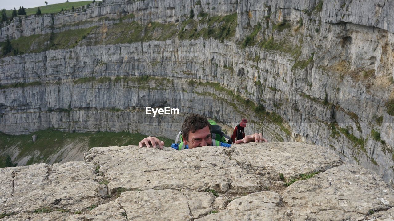 Man climbing on rock formation