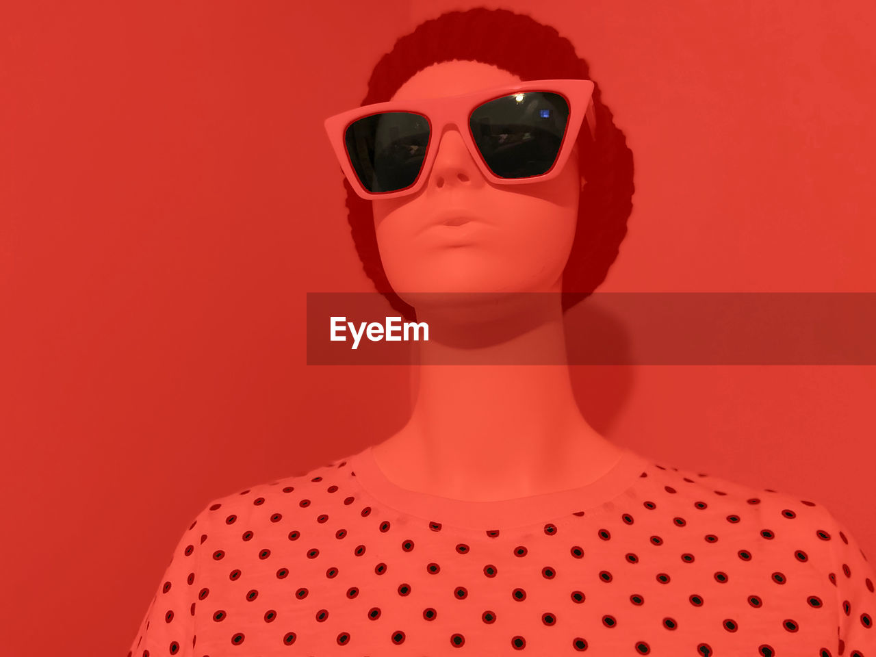 Mannequin wearing a hat and sunglasses on a modern realistic pop art style setting. Pop Style Art Concert Studio Singer  People Rock Star Woman Girl Adult Advertisement HEAD Mannequin Retro Young Trendy Hat Hipster Chic Portrait Sunglasses Doll Concept Color Blue Apple Smart Phone Clothing Design Female Modern Feminine  Grunge Fashion Copy Space Dummy Merchant Pose