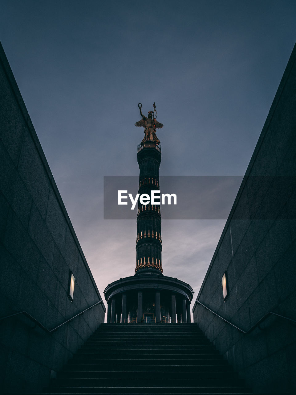 Low angle view of statue against sky during sunset