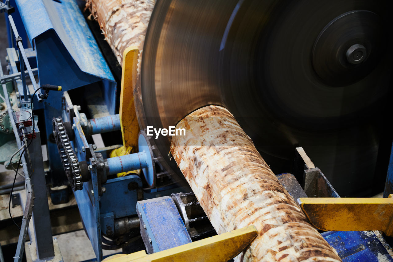 HIGH ANGLE VIEW OF OLD MACHINERY IN FACTORY