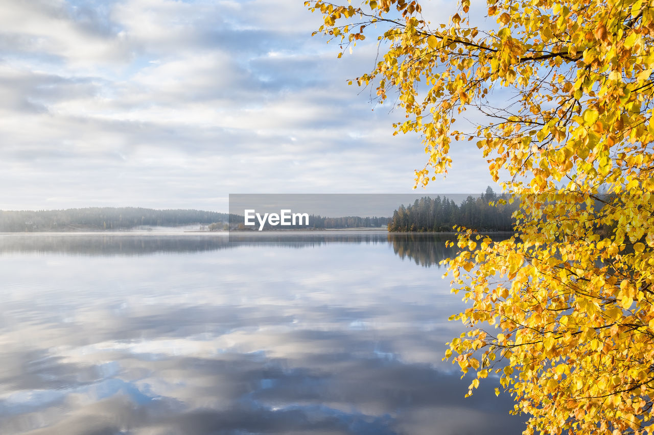 Scenic view of lake against sky during autumn