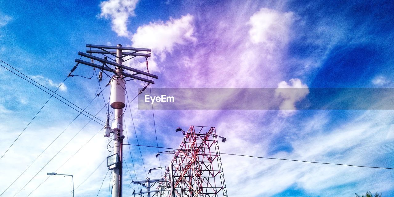 LOW ANGLE VIEW OF ELECTRICITY PYLONS AGAINST SKY