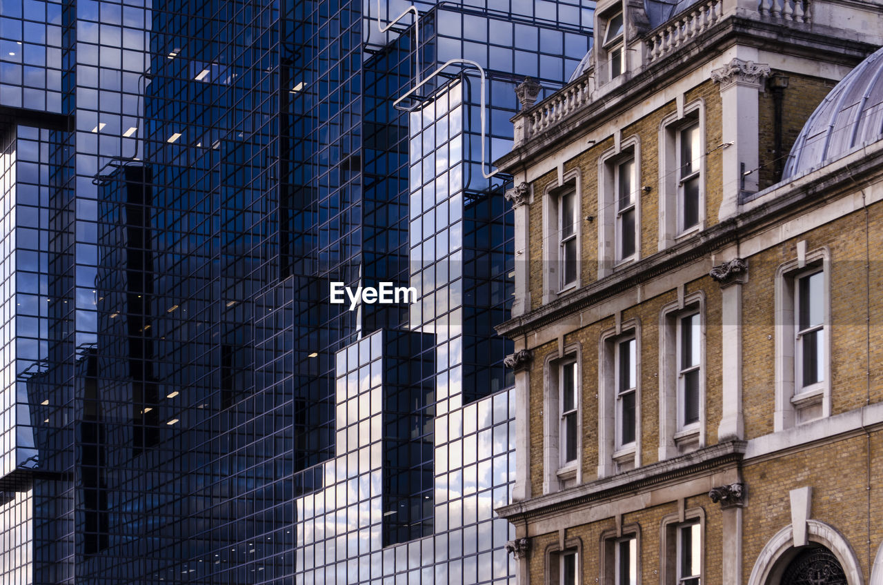 LOW ANGLE VIEW OF GLASS BUILDING