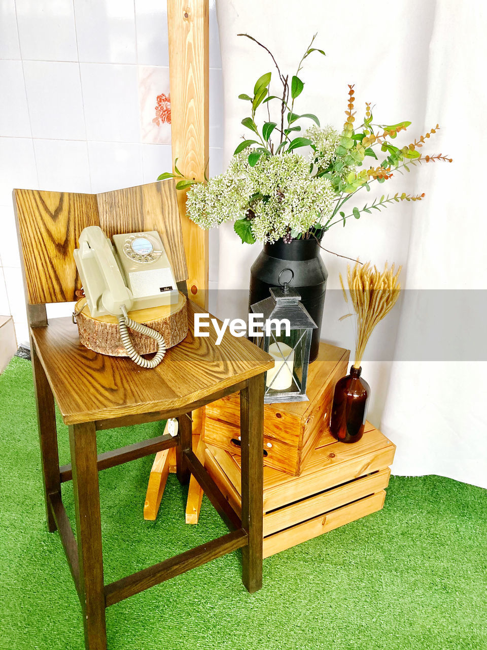 POTTED PLANT ON TABLE BY EMPTY CHAIR AT HOME