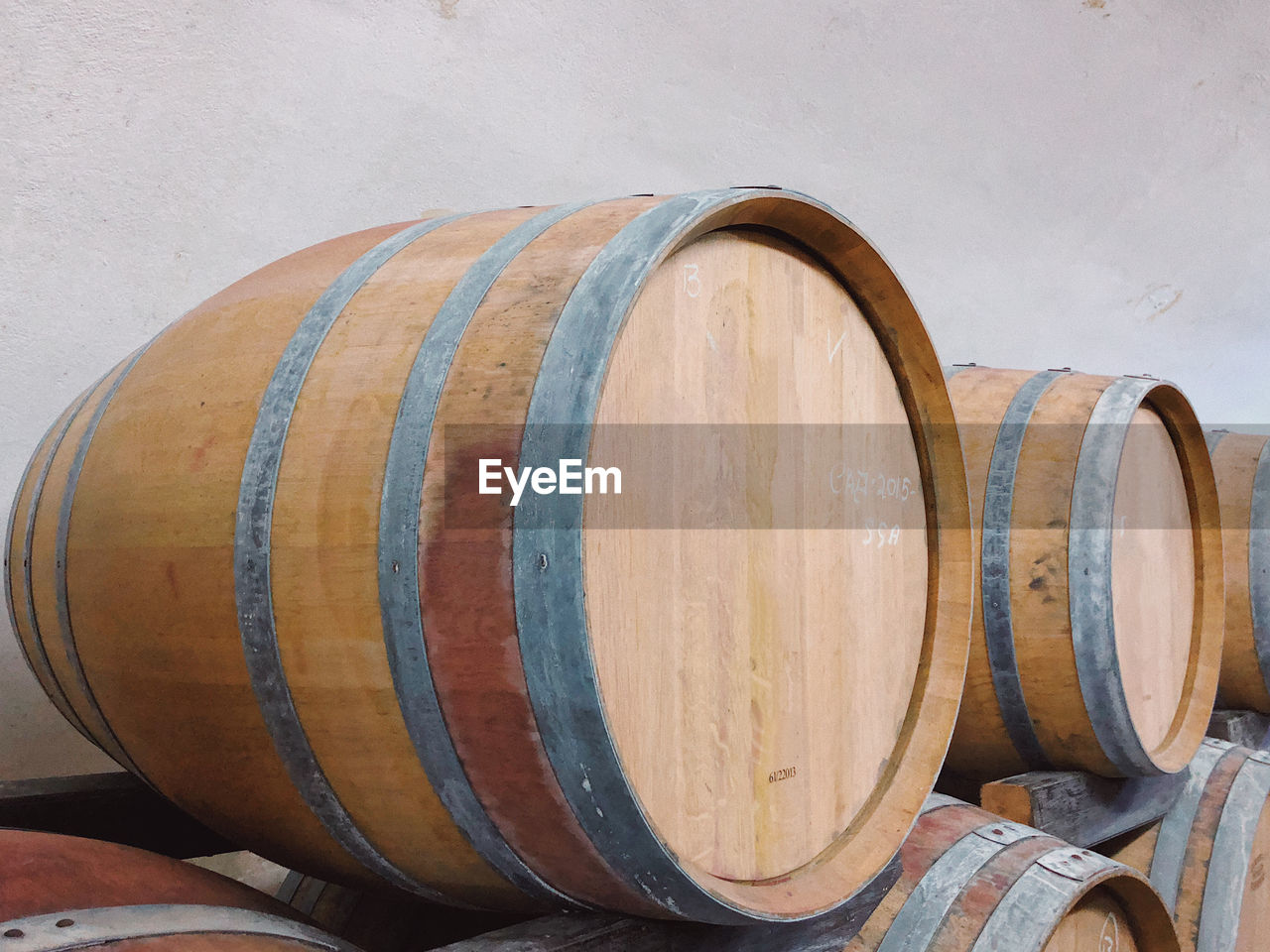 Full frame shot of a wooden barrel of wine inside of a cellar