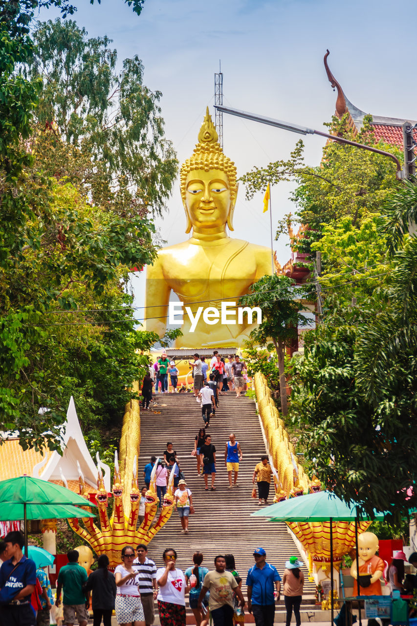 STATUE AGAINST TEMPLE