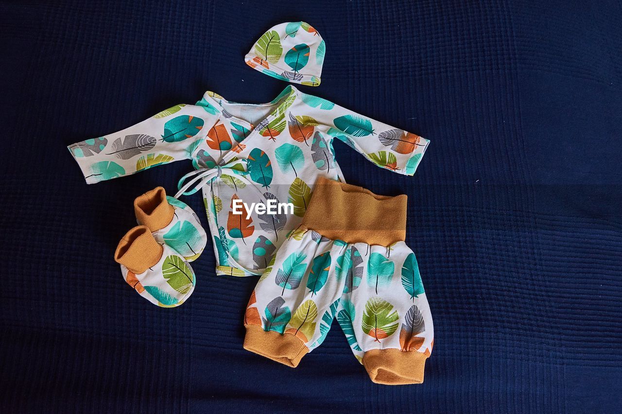 High angle view of baby clothing on table