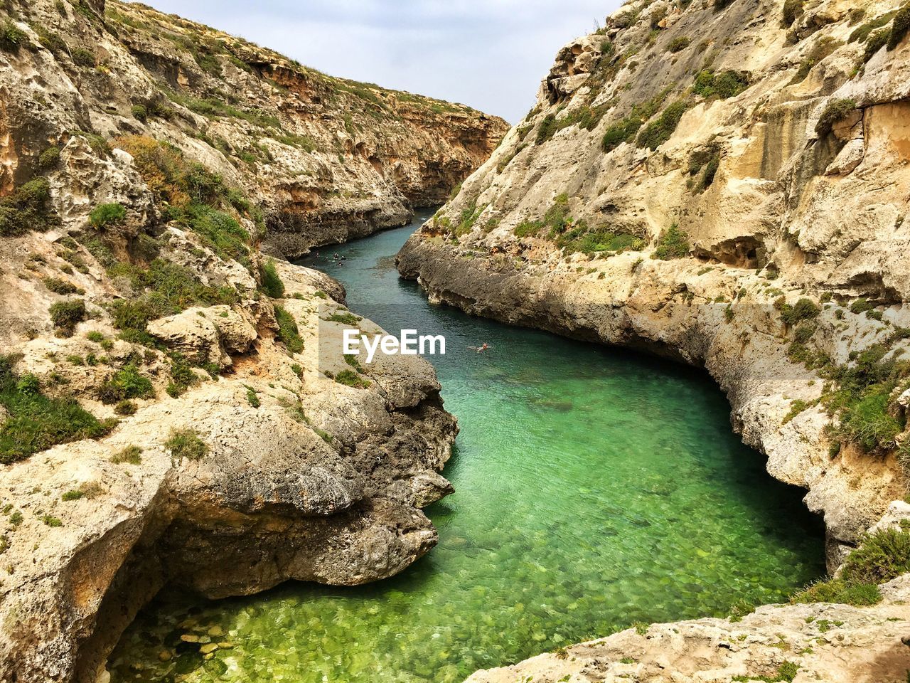 High angle view of river amidst rocks