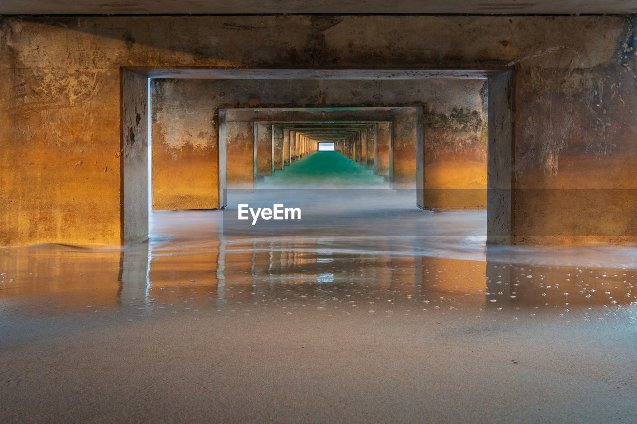 Underneath view of bridge over sea