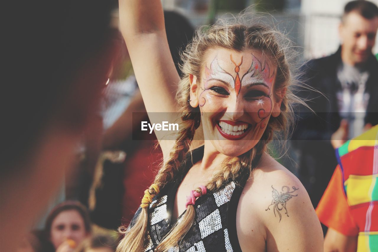 Portrait of smiling woman with face paint 