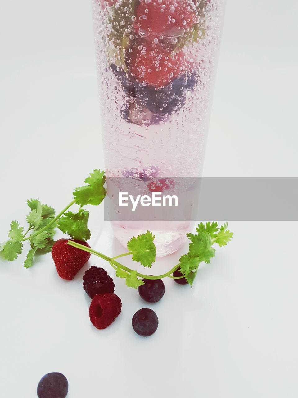 Close-up of strawberry over white background