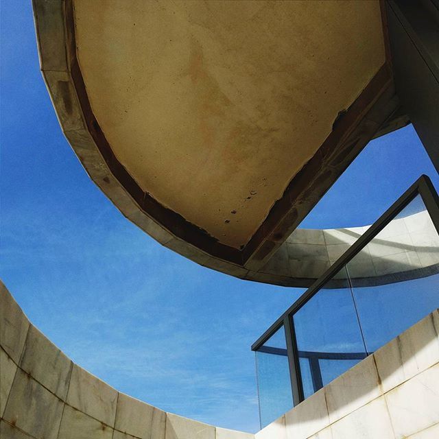 LOW ANGLE VIEW OF BUILT STRUCTURE AGAINST THE SKY