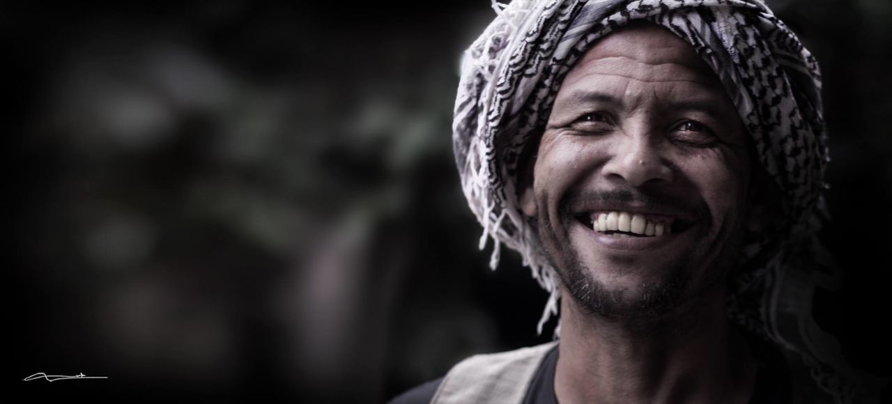 CLOSE-UP PORTRAIT OF MAN WEARING MASK OUTDOORS