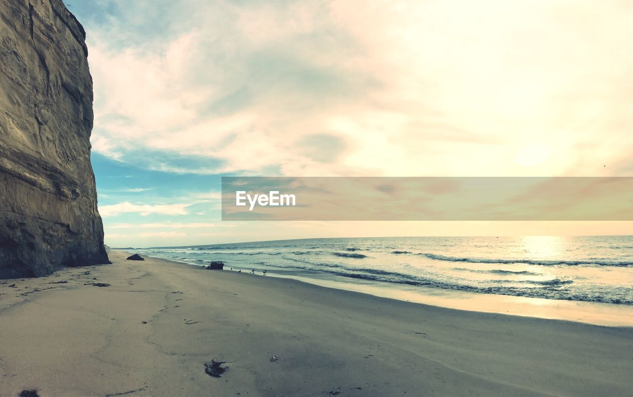 Scenic view of beach against sky