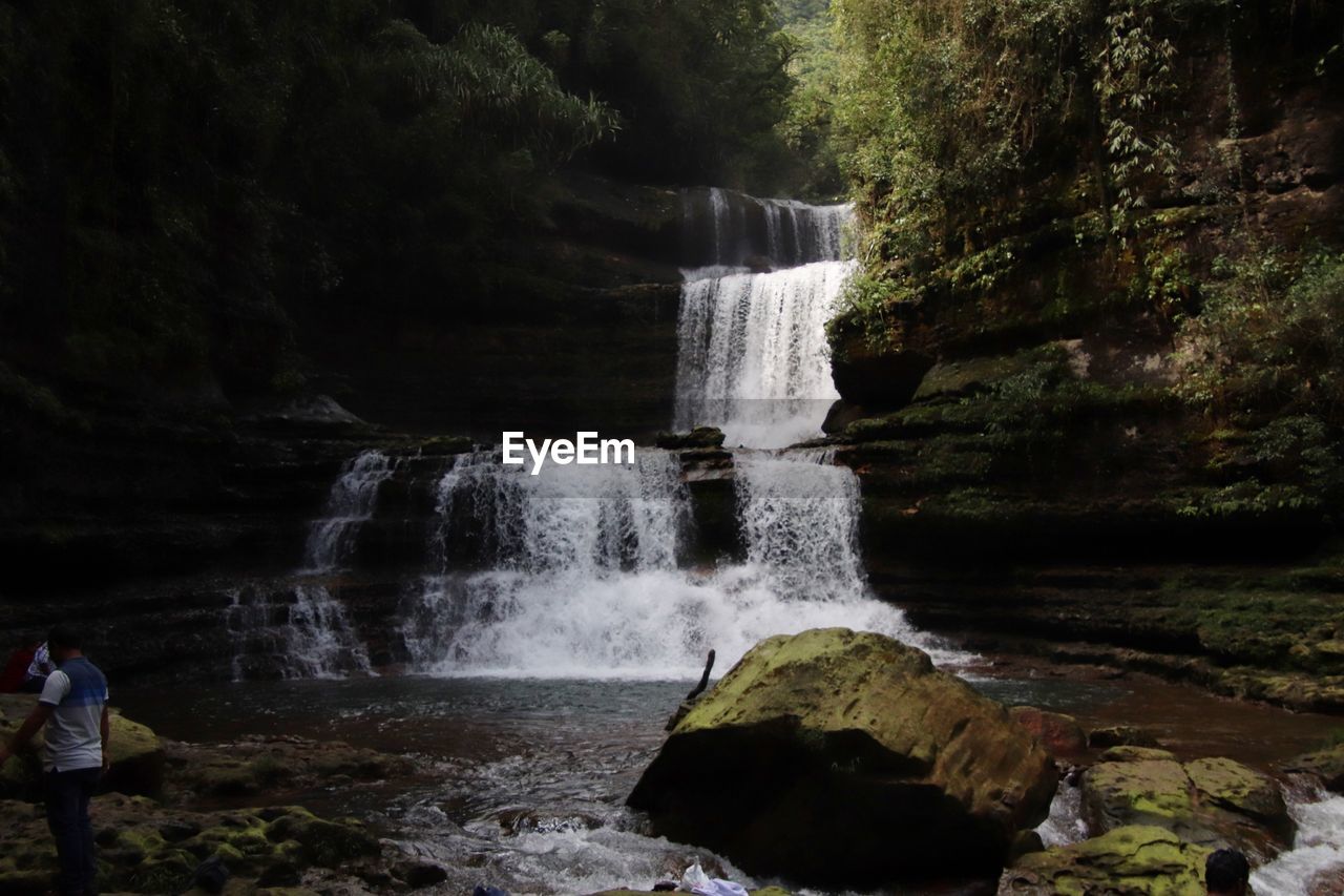 WATER FLOWING THROUGH ROCKS