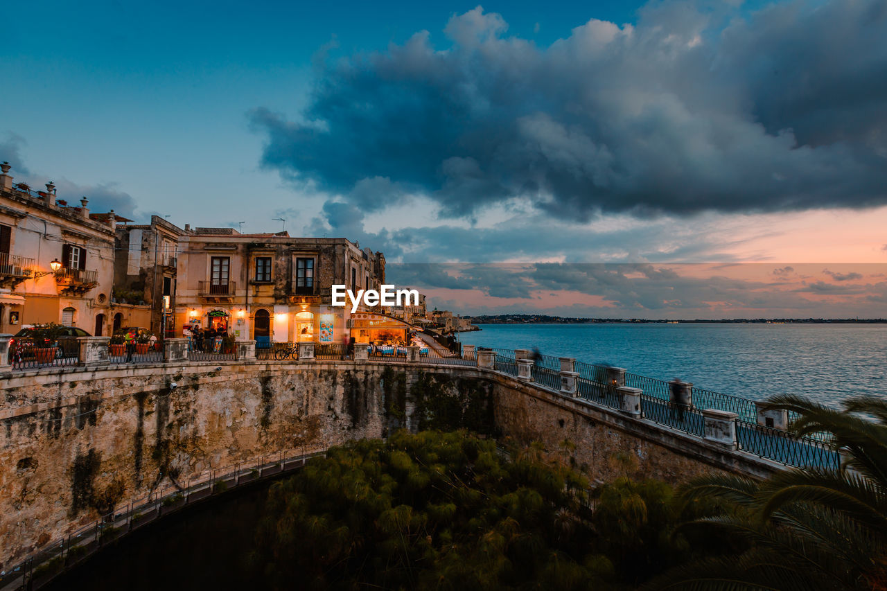 Panoramic view of ortigia with fonte aretusa and lungomare alfeo  during sunset