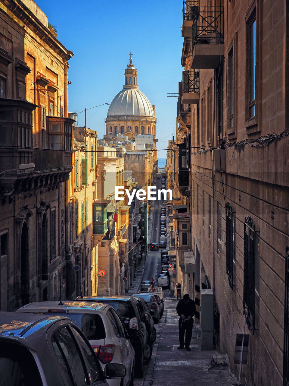 STREET AMIDST BUILDINGS IN CITY