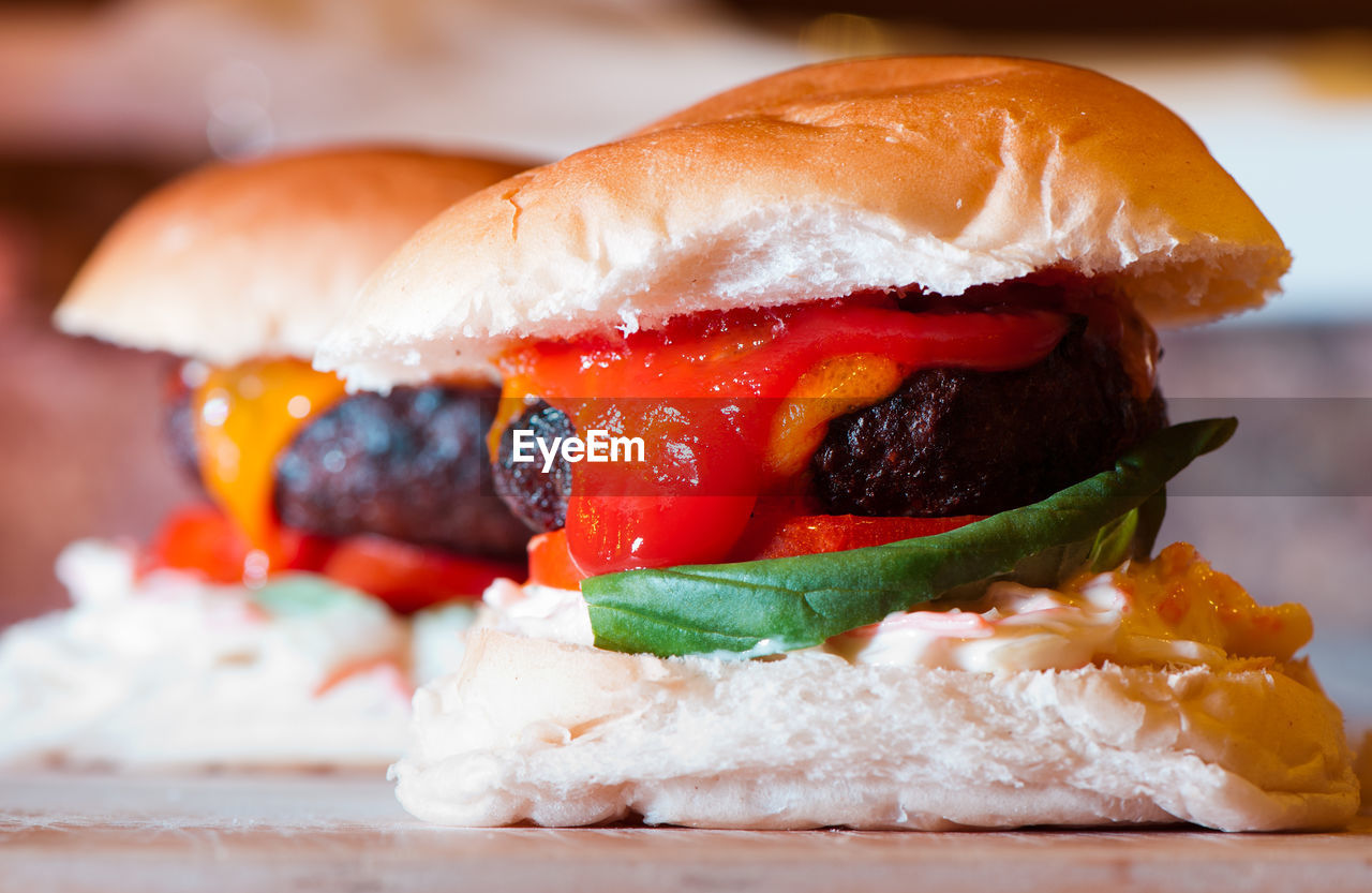 Close-up of burgers on table