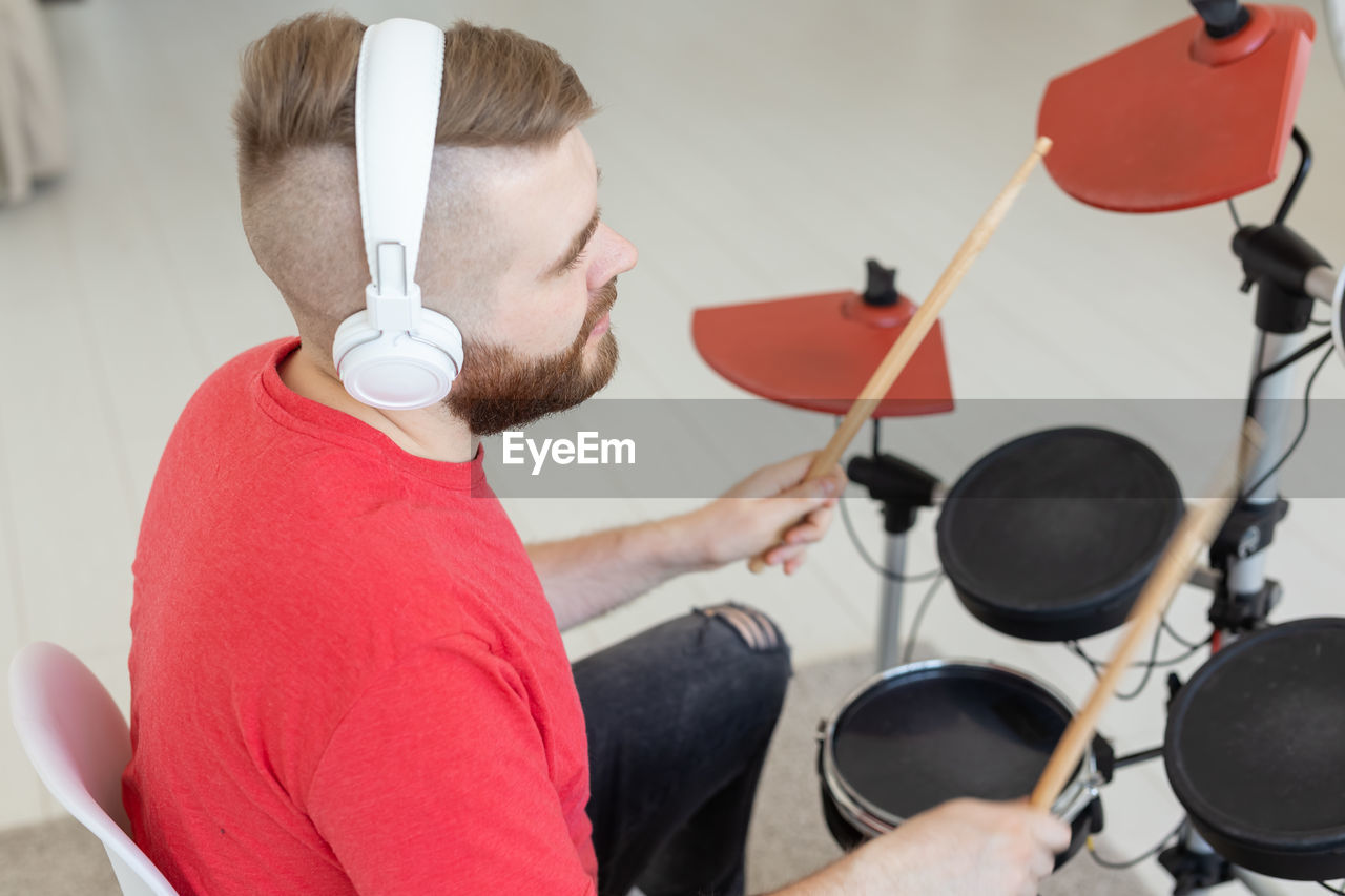 Midsection of man playing piano