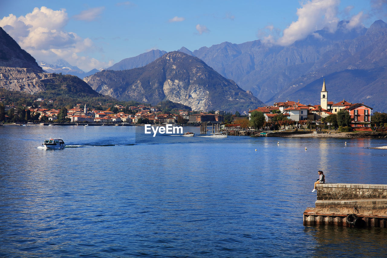 VIEW OF LAKE AGAINST MOUNTAIN RANGE