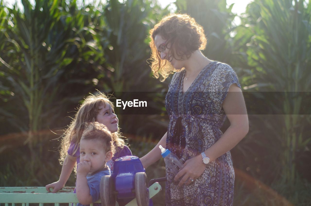 Mother with daughters in garden