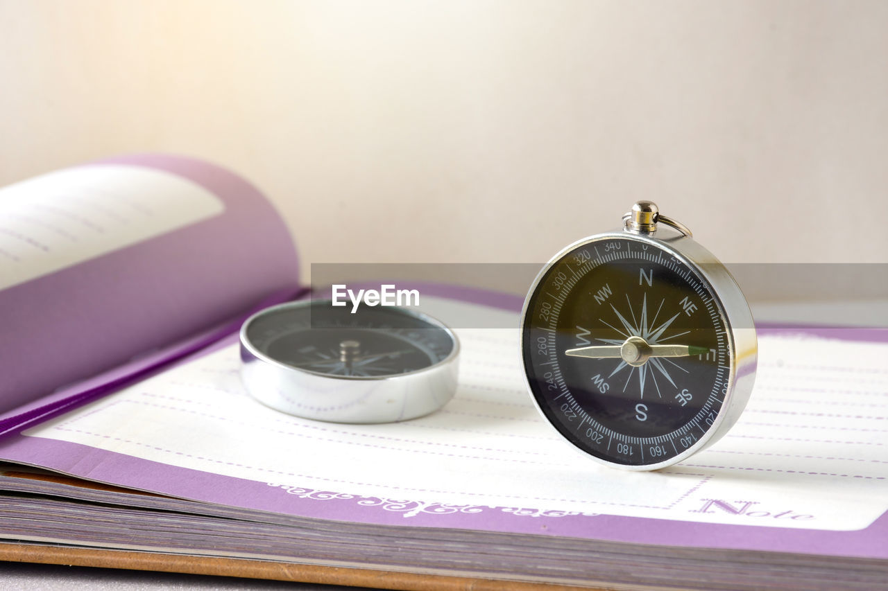 purple, clock, no people, indoors, time, watch, still life, table, violet, close-up, publication