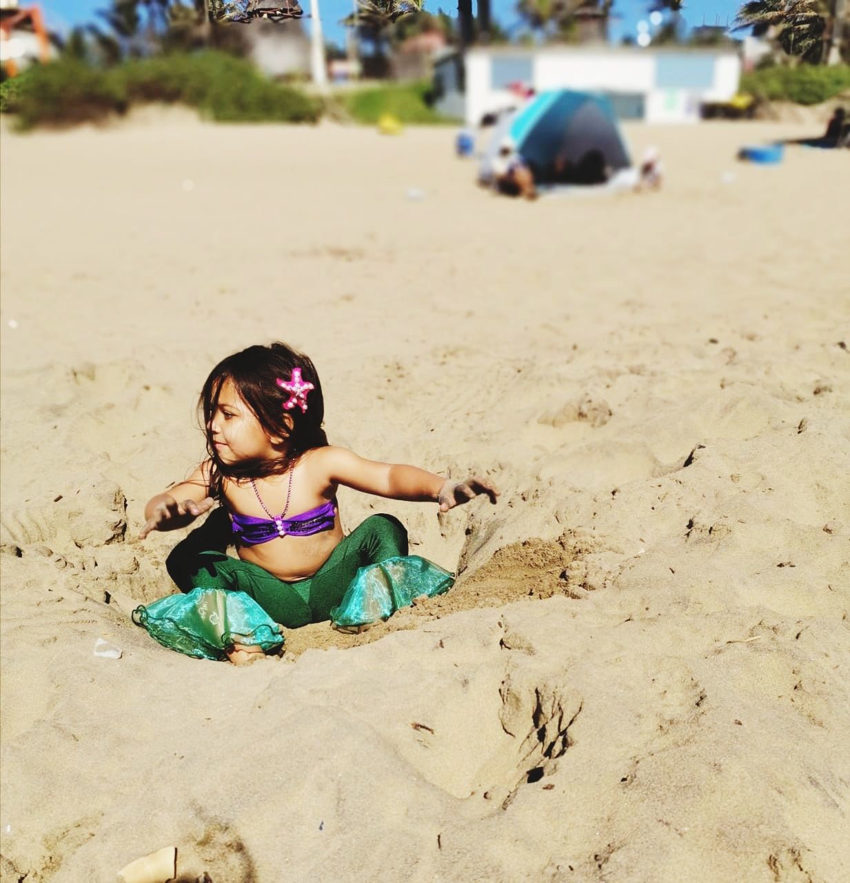 GIRL WEARING SUNGLASSES ON BEACH