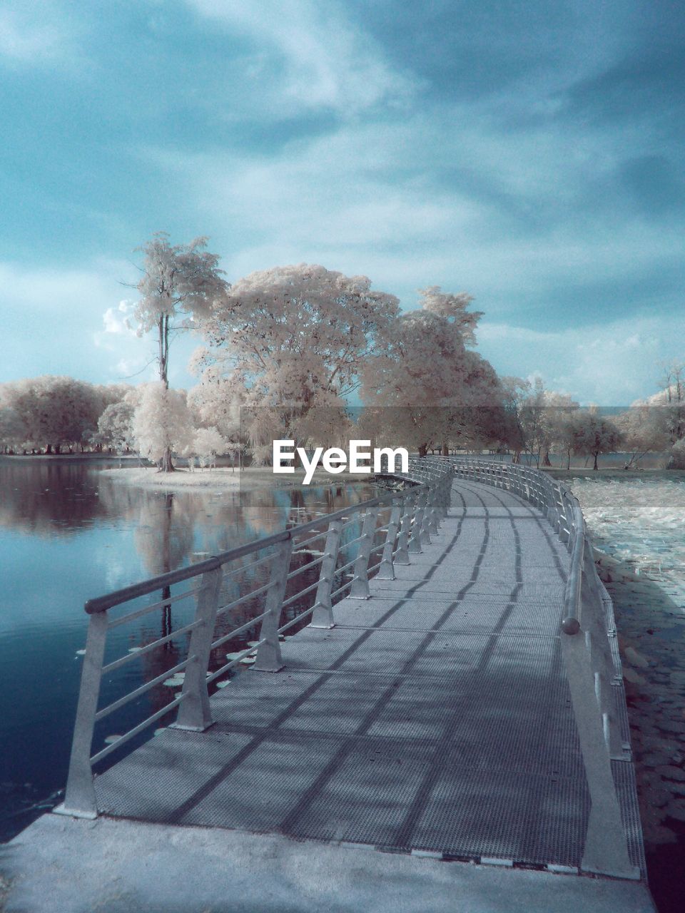 View of footbridge across lake