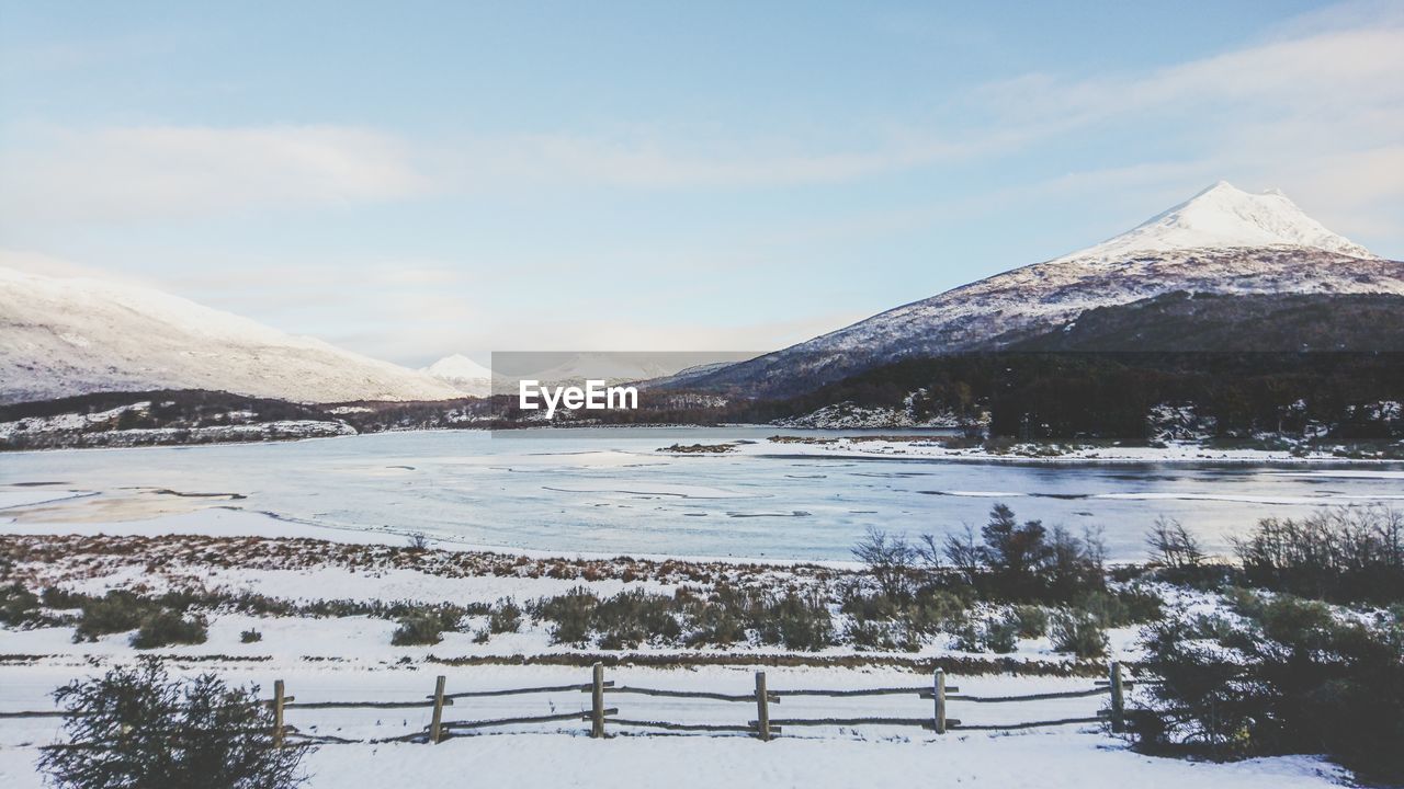 cold temperature, mountain, winter, beauty in nature, sky, scenics - nature, tranquil scene, tranquility, snow, nature, environment, water, landscape, lake, snowcapped mountain, non-urban scene, cloud - sky, day, no people, mountain range, outdoors, mountain peak, salt flat