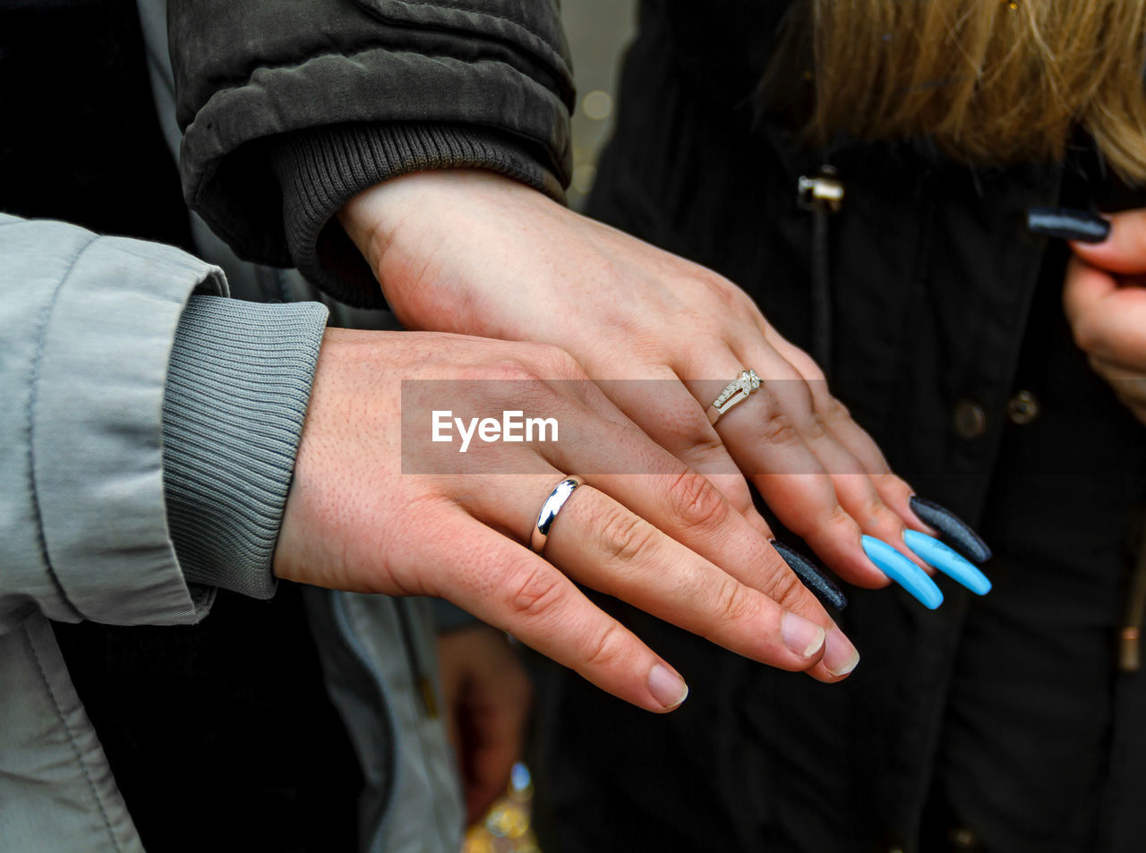 Hands of just married with wedding rings