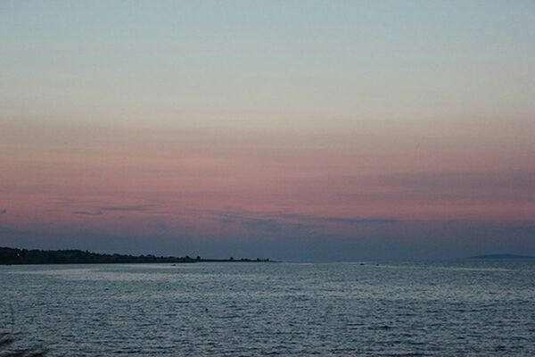 VIEW OF SEA AT SUNSET