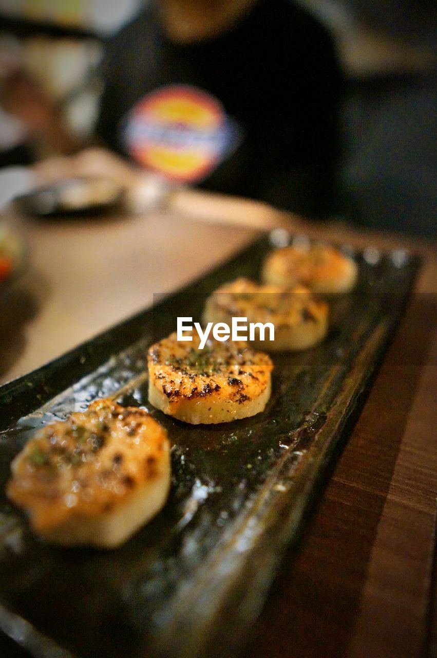 CLOSE-UP OF DESSERT IN PLATE ON TABLE