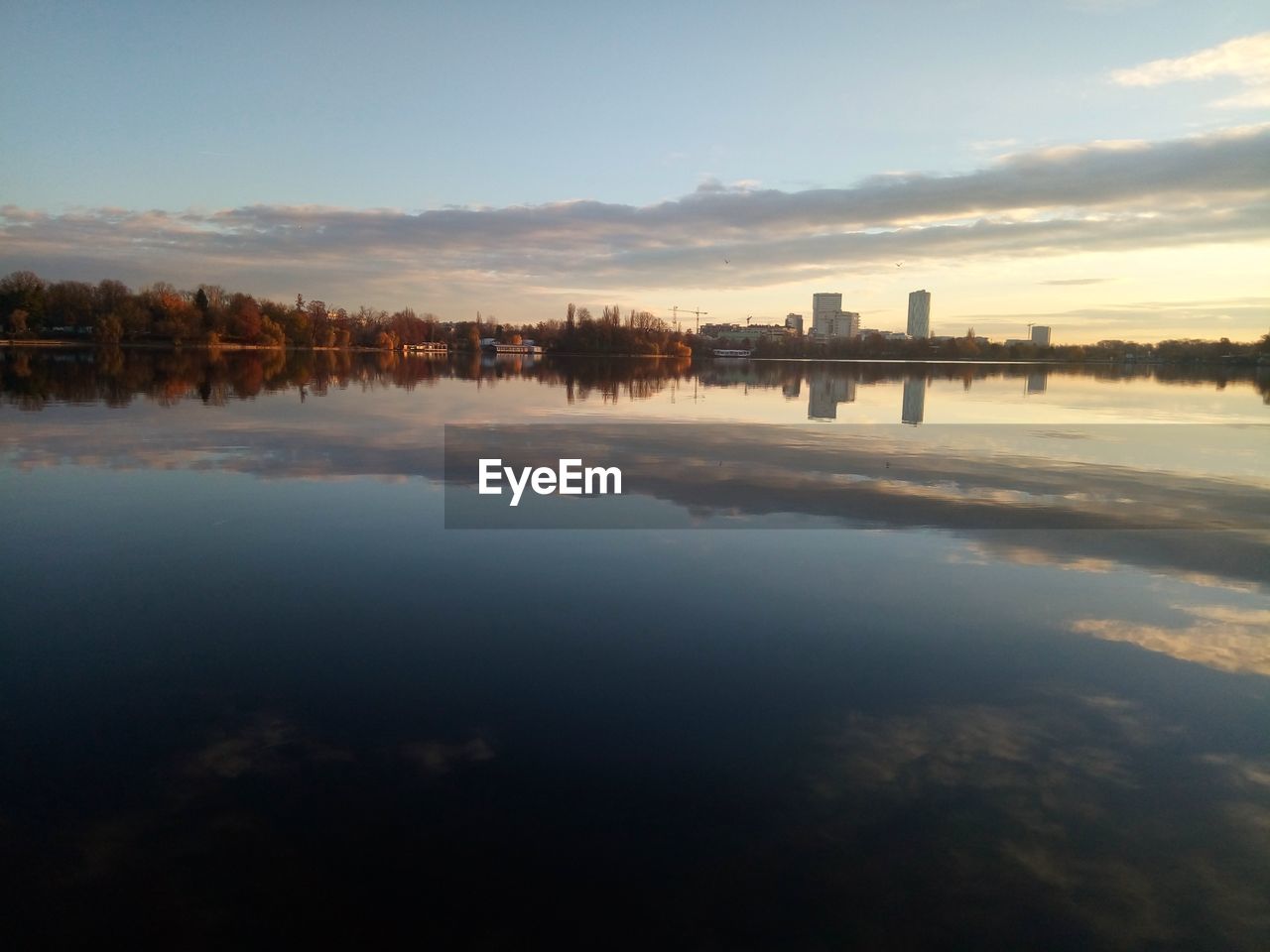 Scenic view of lake against sky during sunset