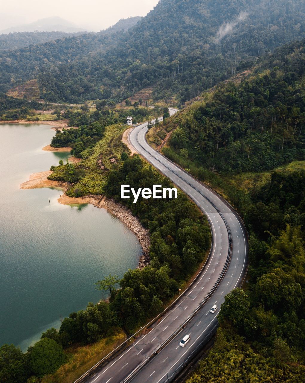 High angle view of road by mountains and sea