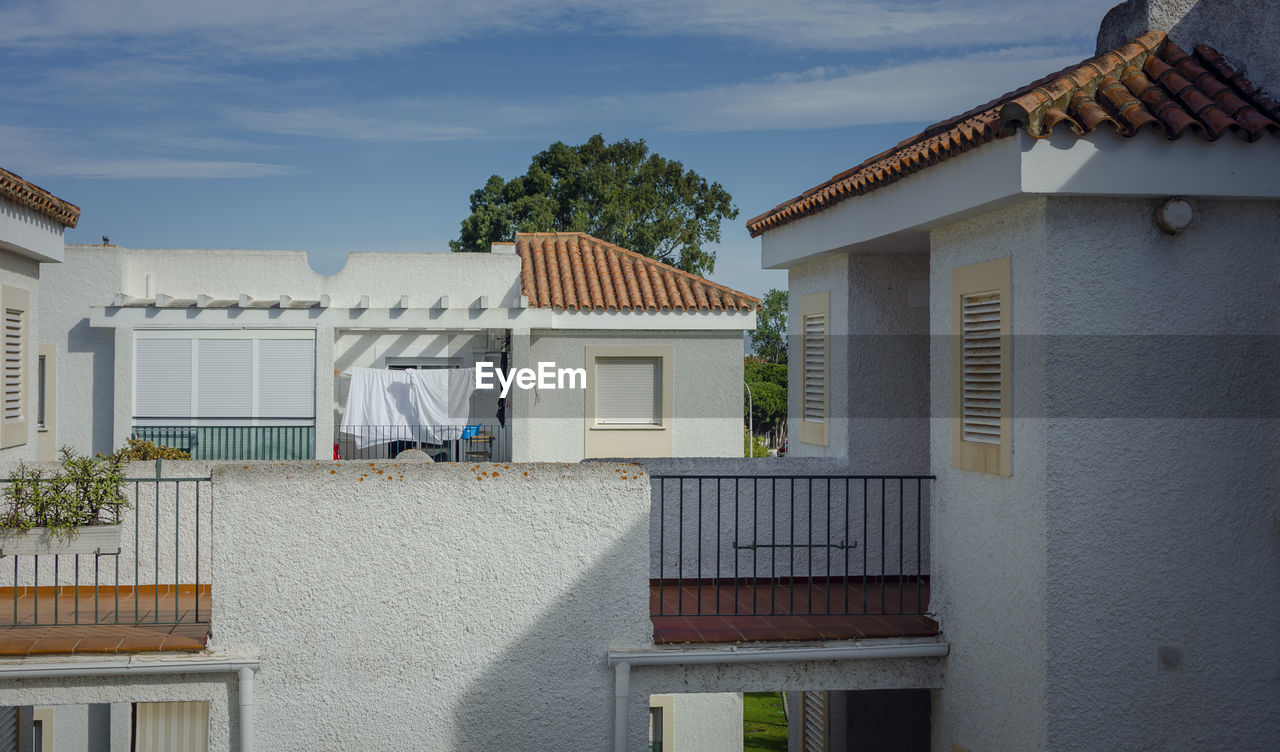 Facade of a white building in rota, cadiz, spain. summer 2020.